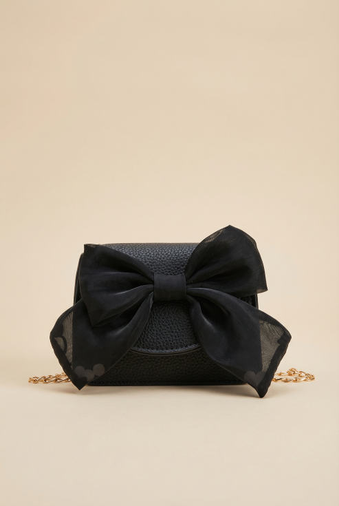 bolsa preta menina, bolsa elegante menina, bolsa com laço menina, bolsa com corrente dourada, acessórios para menina, presente para menina, bolsa infantil elegante, bolsa de festa menina, bolsa para ocasiões especiais, bolsa moda infantil