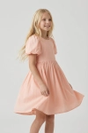 Vestido de cerimónia Sia cor-de-rosa para menina, com mangas balão – vista de frente, saia em movimento